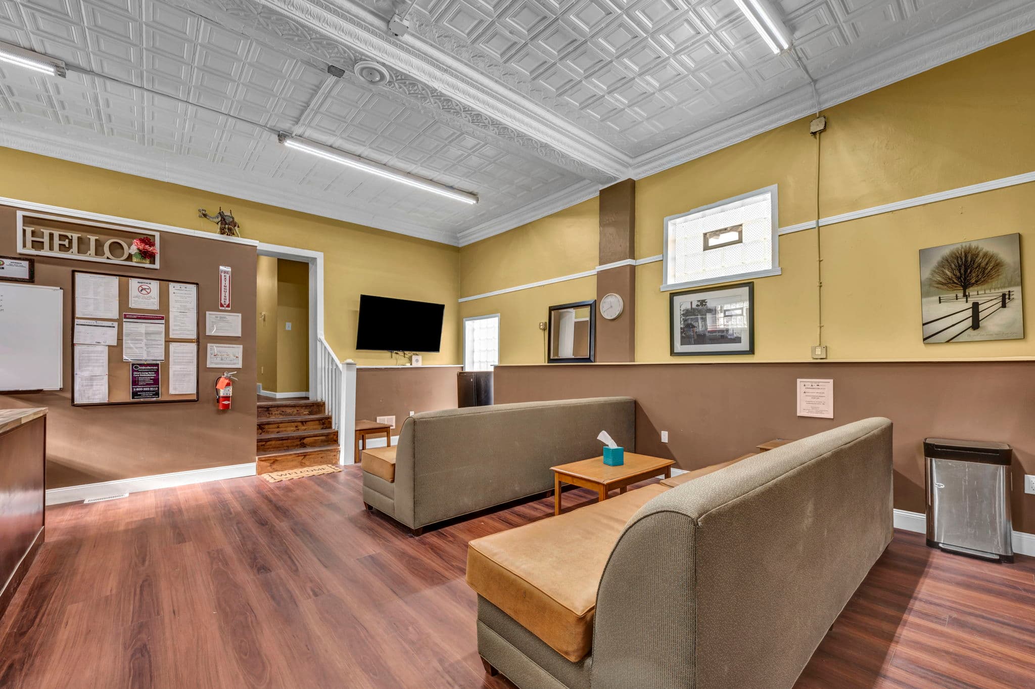 Bright, welcoming common room with comfortable seating and natural light